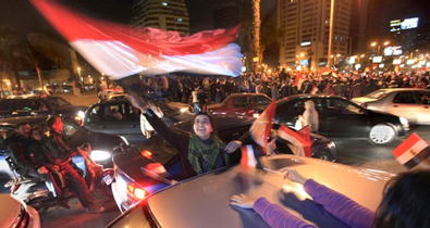 Egyptians celebrate after President Hosni Mubarak resigned and handed power to the military in Cairo, Egypt, Friday, Feb. 11, 2011. Egypt exploded with joy, tears, and relief after pro-democracy protesters brought down President Hosni Mubarak with a momentous march on his palaces and state TV.(AP Photo/Amr Nabil)